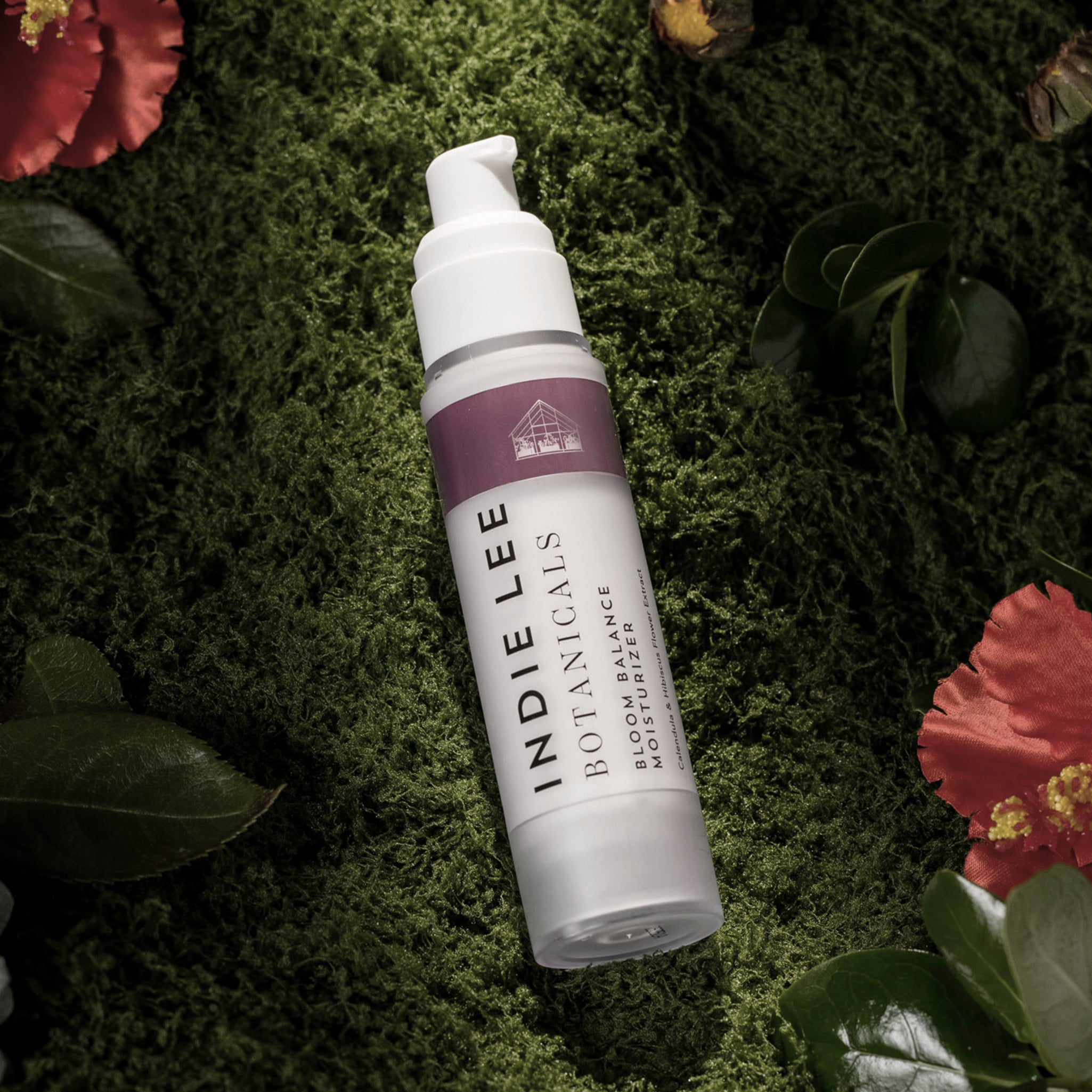 Indie Lee Botanicals Bloom Balance Moisturizer on a green leafy background