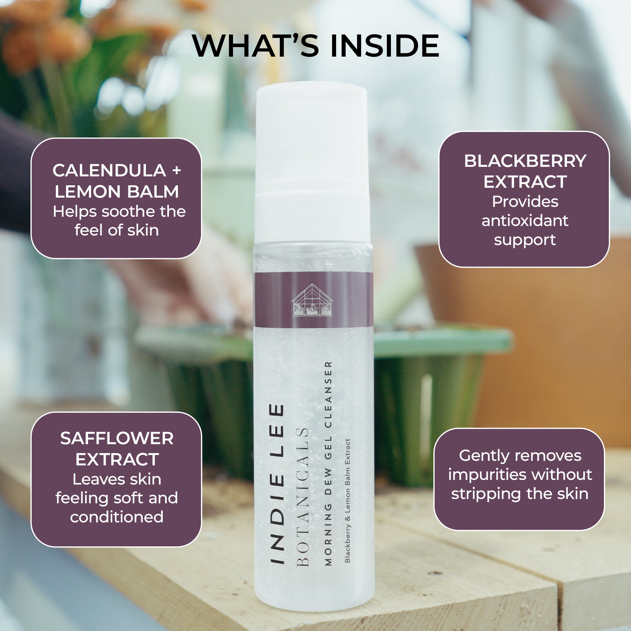 Indie Lee Botanicals cleanser bottle with ingredients listed on a blurred background