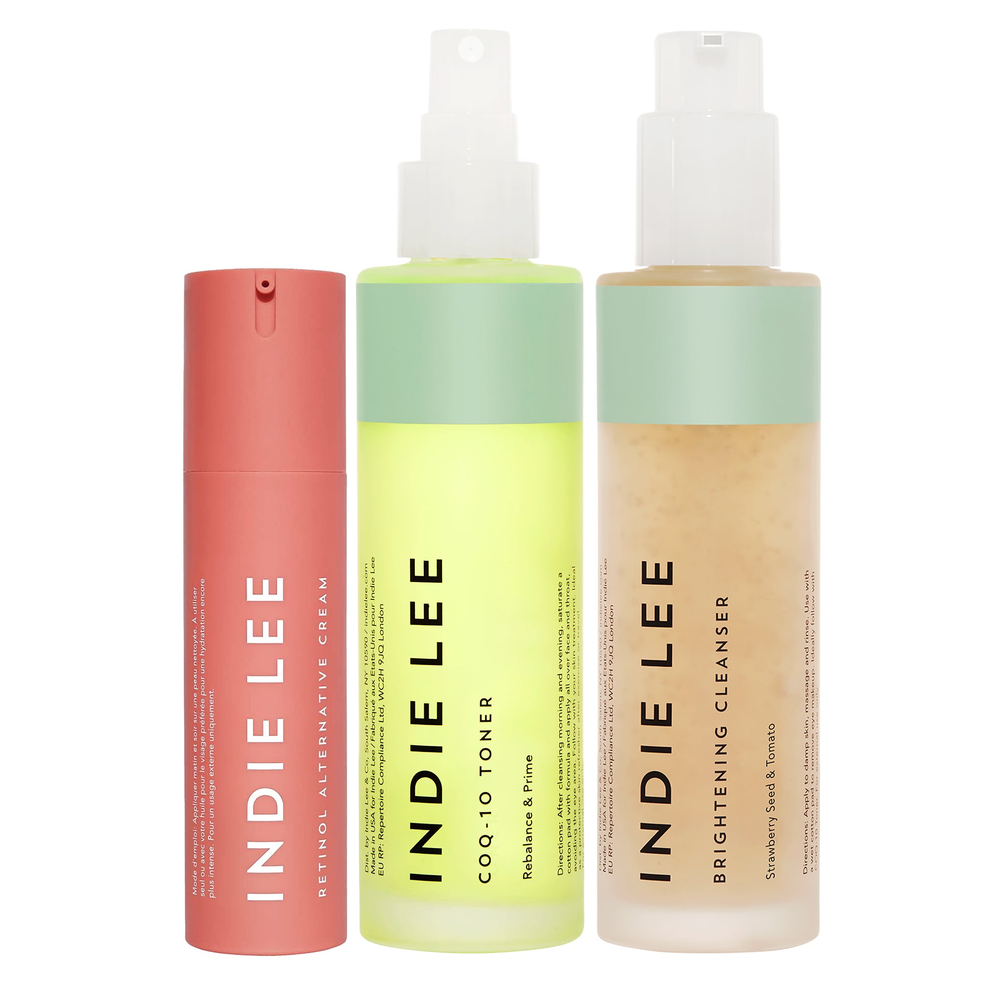 Three bottles of Indie Lee skincare products on a white background