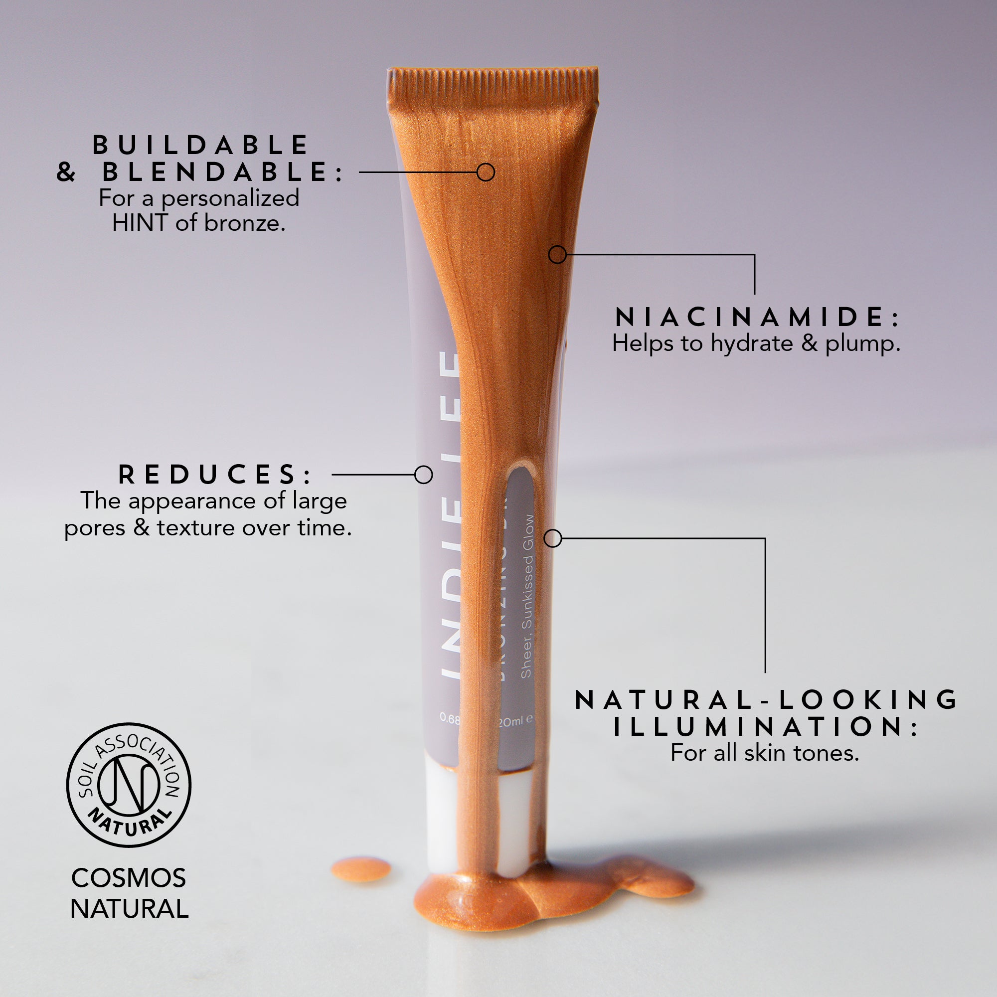 Indie Lee Bronzing Drops tube with text highlighting features on a gray background